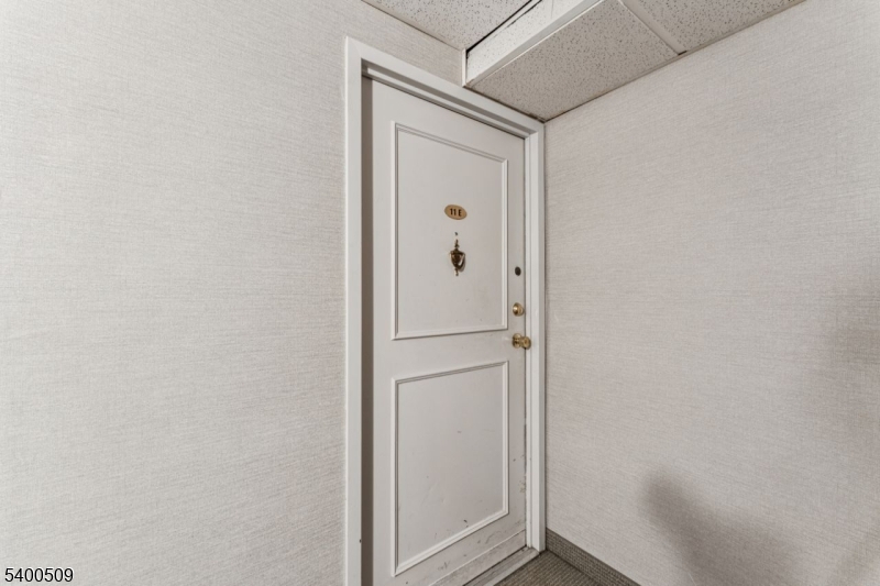 170 Lafayette Avenue, Unit 11E Passaic, NJ 07055 - Photo 20 of 32 a bathroom with a glass door