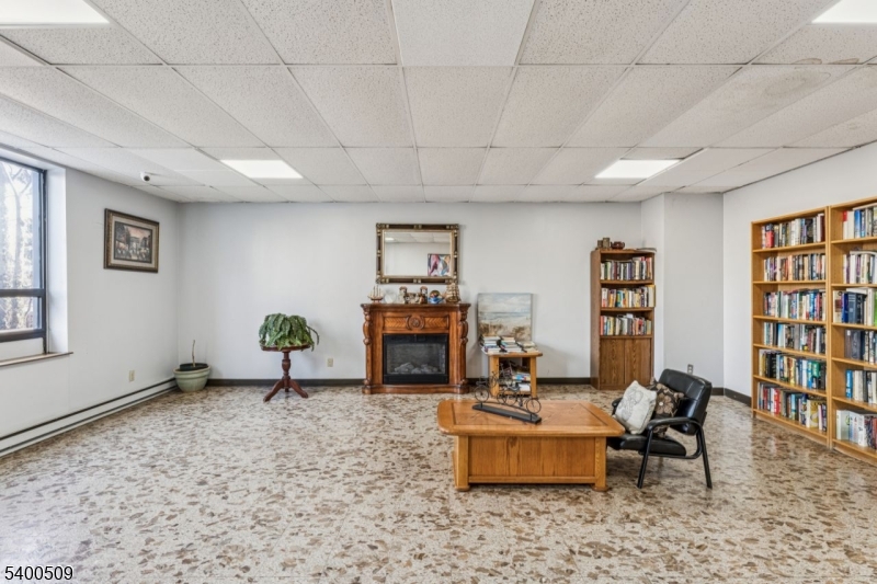 170 Lafayette Avenue, Unit 11E Passaic, NJ 07055 - Photo 25 of 32 a living room with furniture window and wooden floor