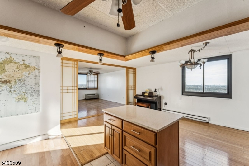 170 Lafayette Avenue, Unit 11E Passaic, NJ 07055 - Photo 8 of 32 a kitchen with a stove and a refrigerator