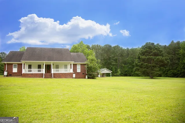 a view of a house with a garden