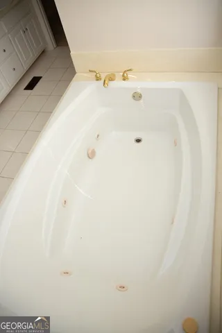 a bathroom with a shower and a bath tub