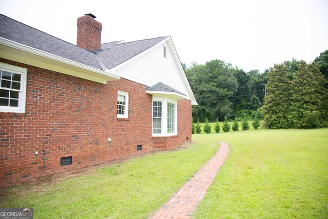 a front view of a house with yard