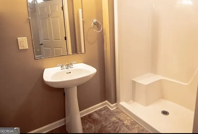 a bathroom with a sink and a mirror