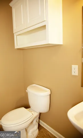 a bathroom with a toilet and a bathtub