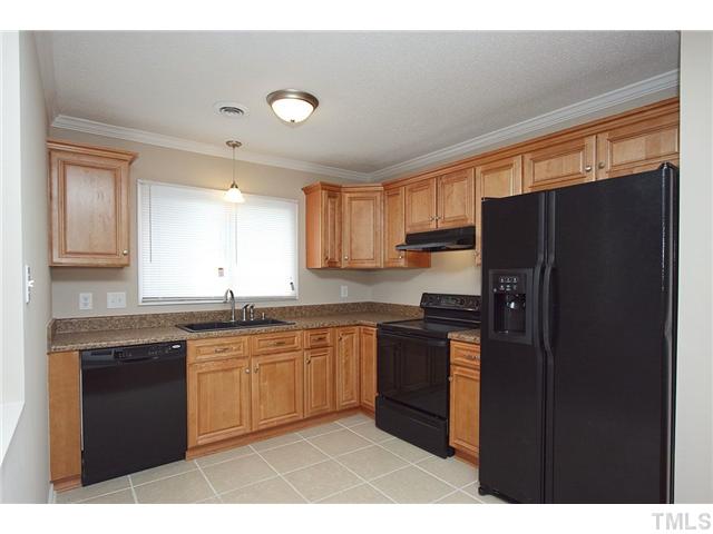 3913 Peppertree Place Raleigh, NC 27604 - Photo 3 of 13 Updated kitchen ... beautiful fixtures ... a pleasure to cook or hangout!