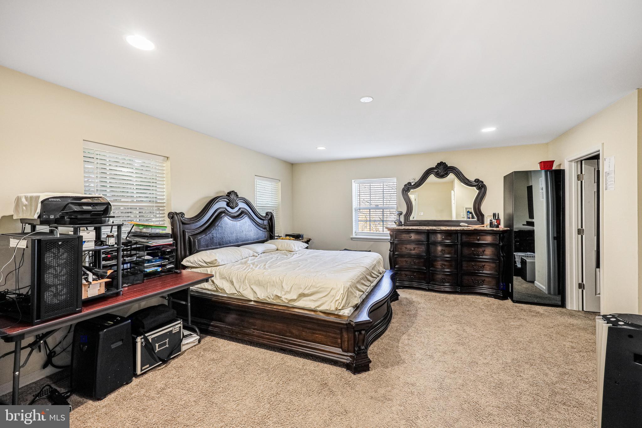 14816 Bushy Park Road Woodbine, MD 21797 - Photo 14 of 40 a spacious bedroom with a bed and a walk in closet