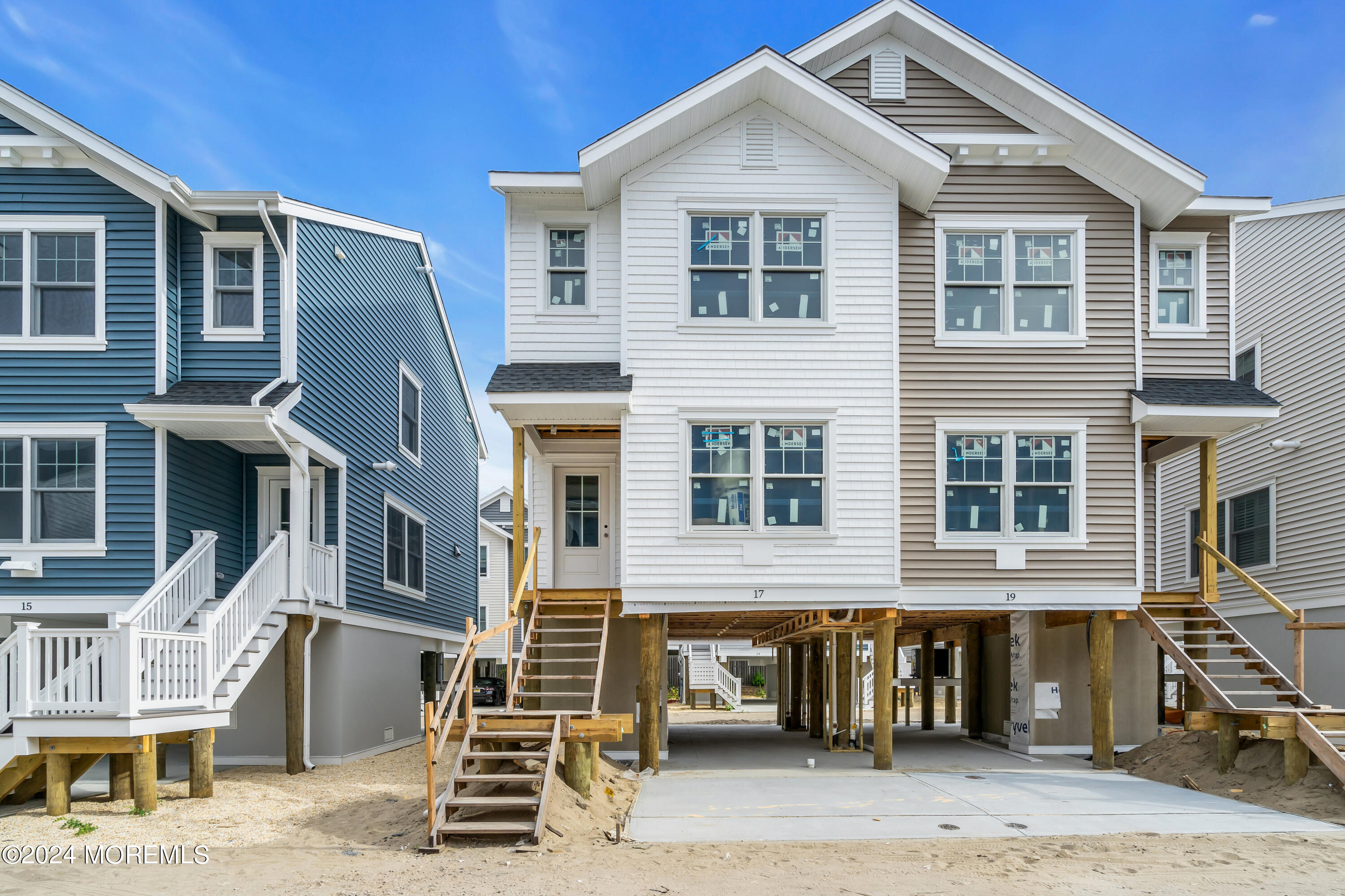 17 Shell Road, Unit 138 Mantoloking, NJ 08738 - Photo 1 of 45 a front view of a building with many windows