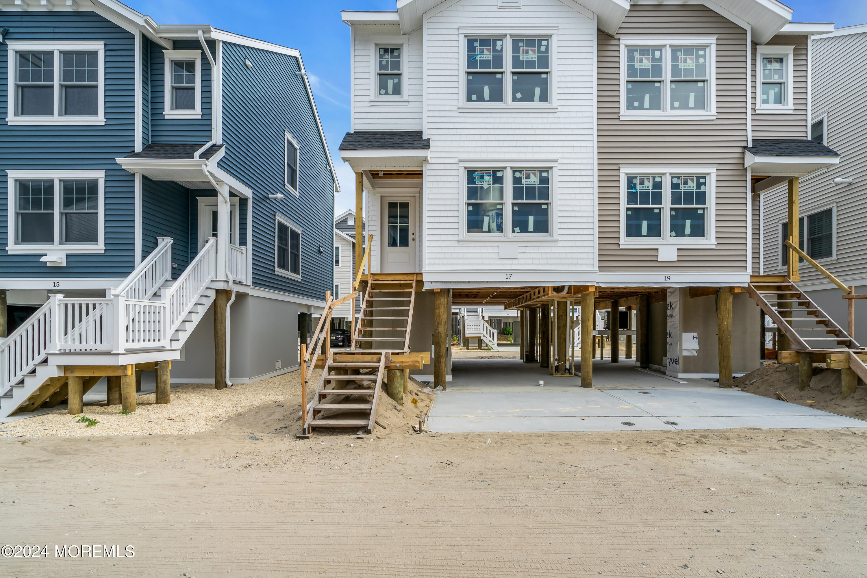 17 Shell Road, Unit 138 Mantoloking, NJ 08738 - Photo 3 of 45 a view of a blue house with large windows