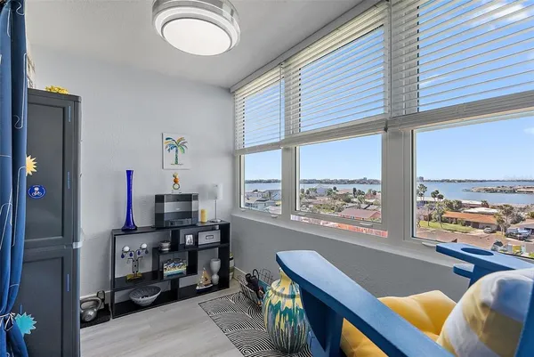 a view of a livingroom with furniture and a window