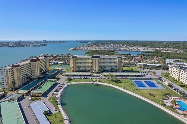 a view of a balcony with two chairs and a table