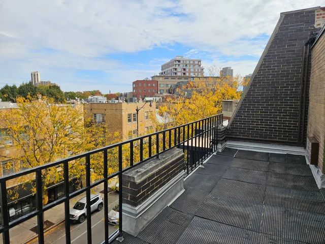 a view of a balcony with city view