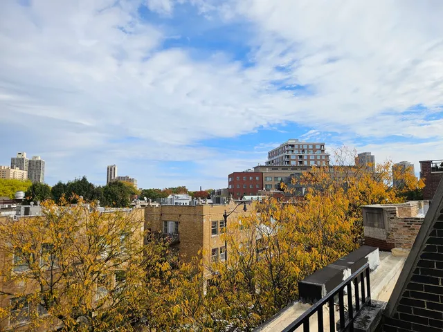 a view of a city with tall buildings