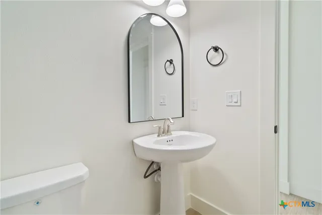 a view of a small space with wooden floor