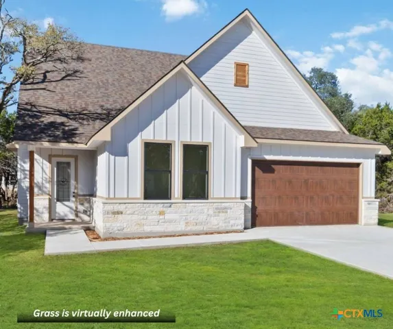 a living room with a couch and chandelier