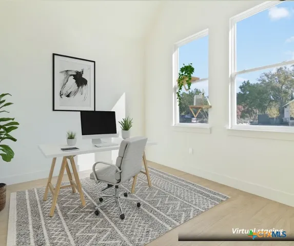 a work room with furniture and a window