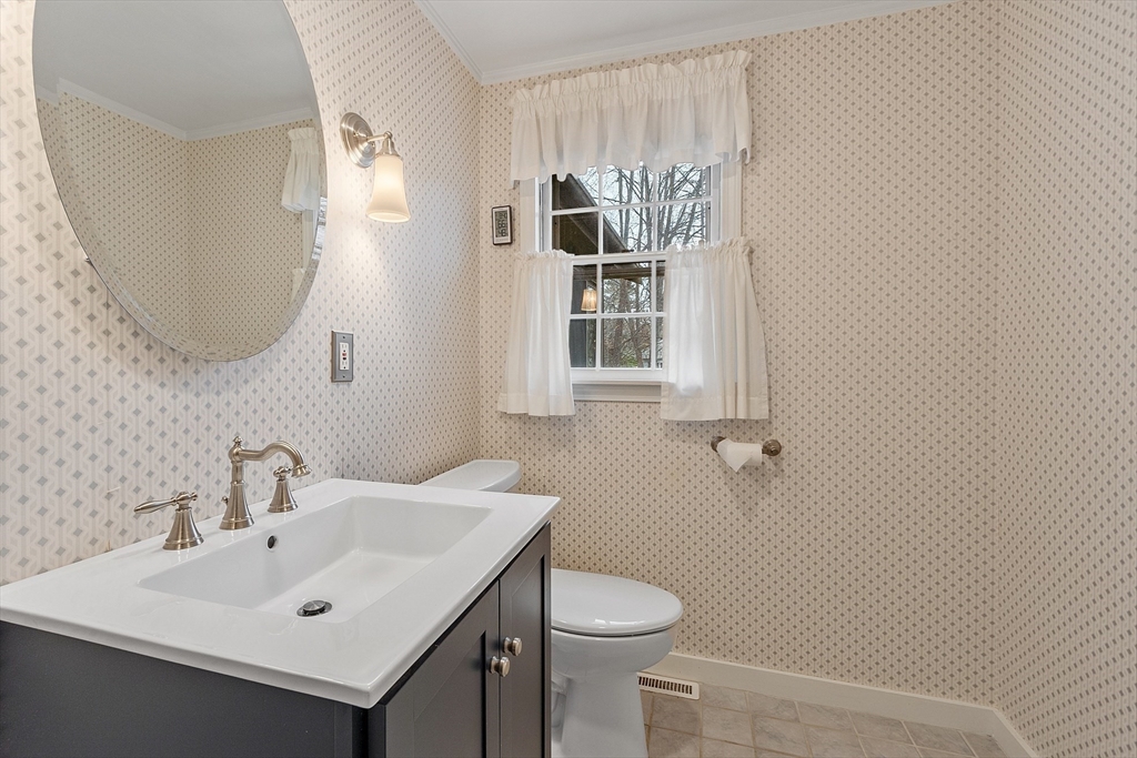 14 Ocean Street Manchester, MA 01944 - Photo 20 of 25 a bathroom with a sink a toilet and shower