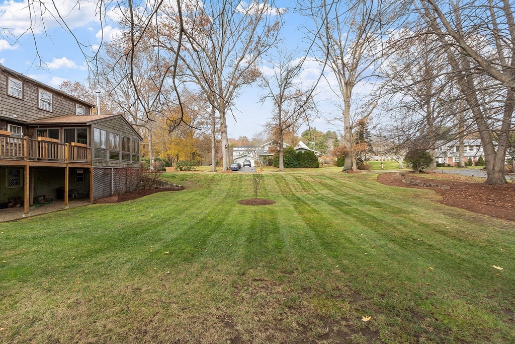 14 Ocean Street Manchester, MA 01944 - Photo 23 of 25 a view of a yard with a house in the background