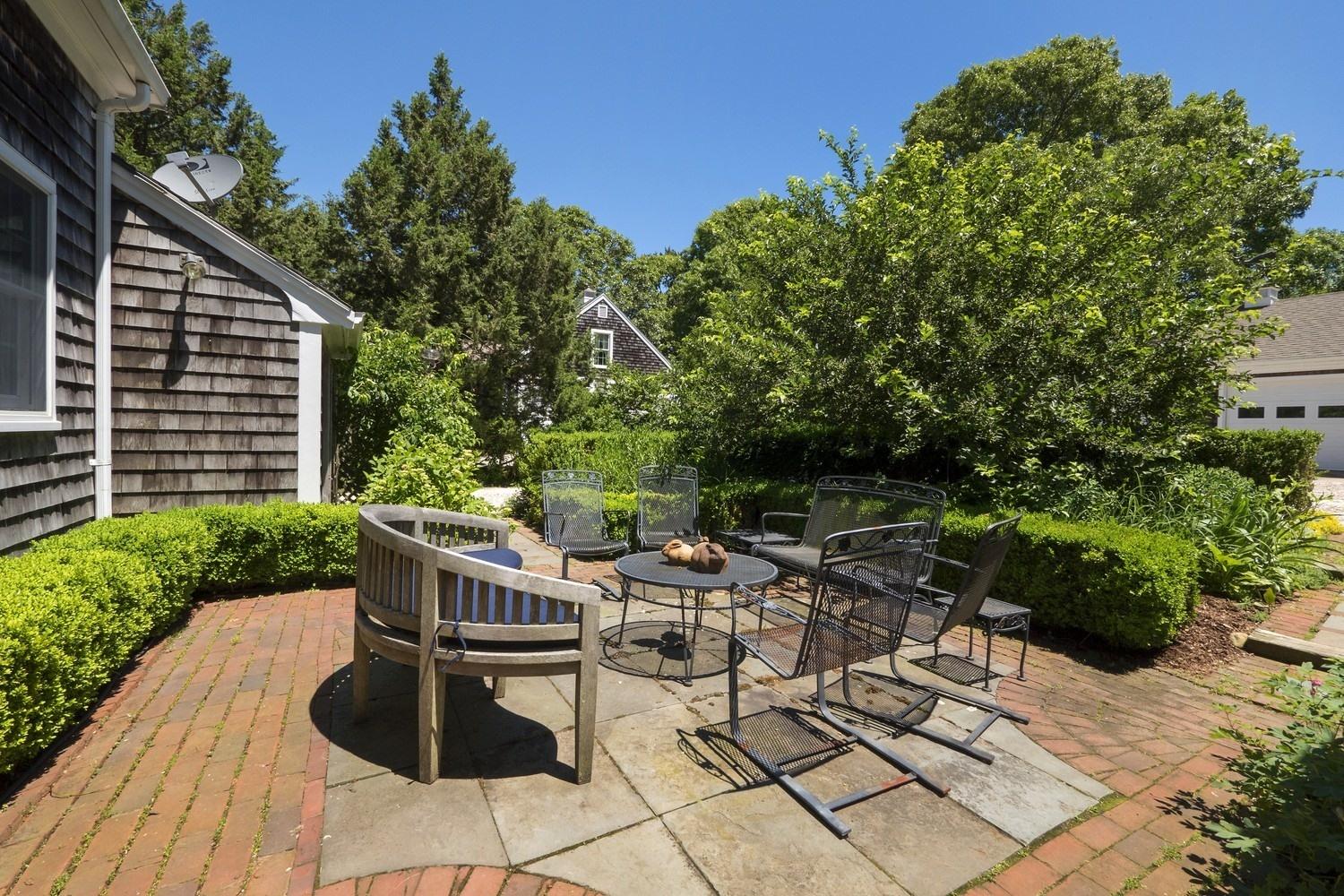 45 Gibson Road Orleans, MA 02653 - Photo 11 of 28 a view of backyard with outdoor seating and plants