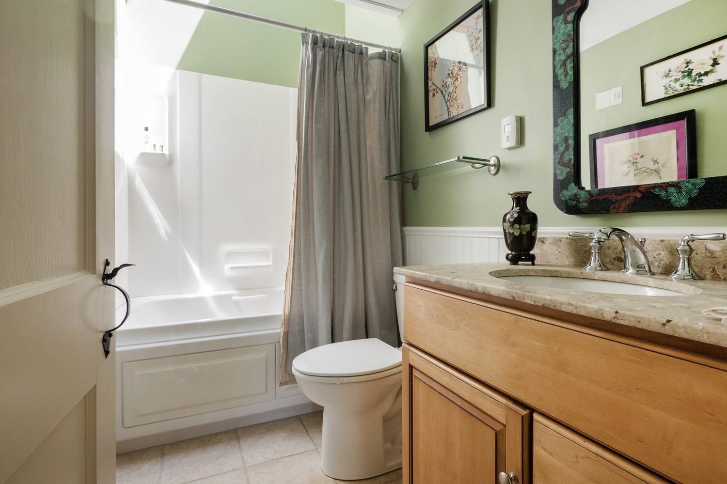 45 Gibson Road Orleans, MA 02653 - Photo 15 of 28 a bathroom with a granite countertop sink toilet and shower