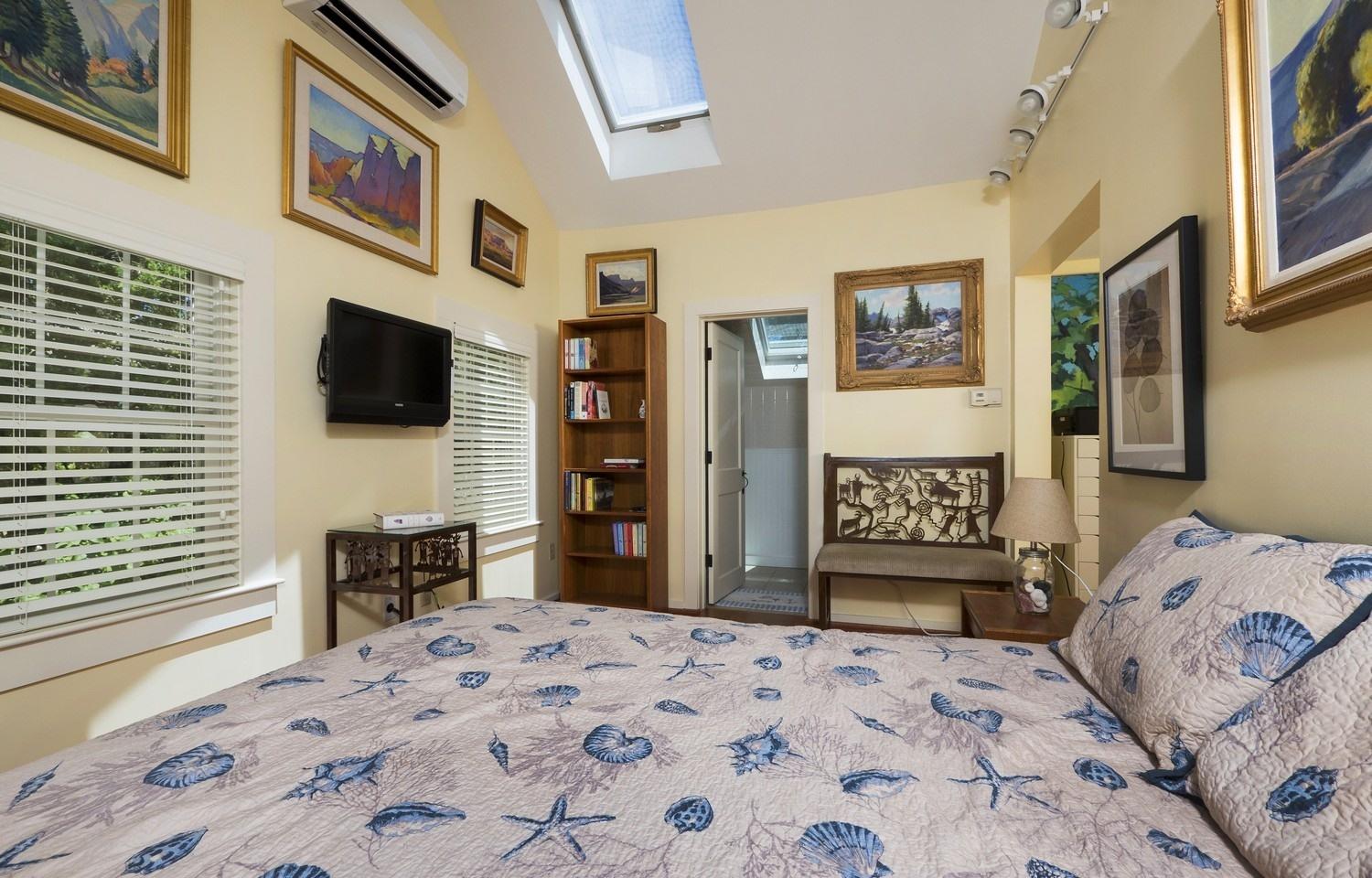 45 Gibson Road Orleans, MA 02653 - Photo 17 of 28 a bedroom with a bed and a flat screen tv on dresser