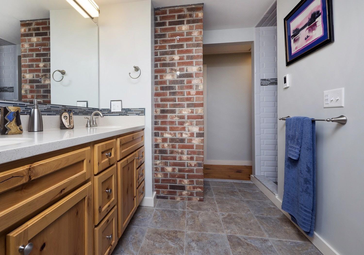45 Gibson Road Orleans, MA 02653 - Photo 21 of 28 a bathroom with a sink a vanity and a mirror