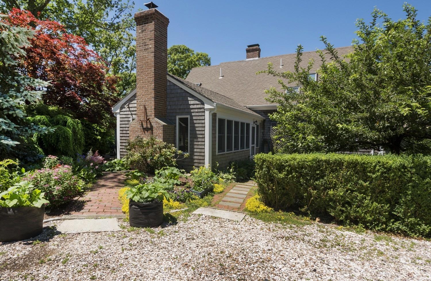 45 Gibson Road Orleans, MA 02653 - Photo 10 of 28 a view of a house with a garden