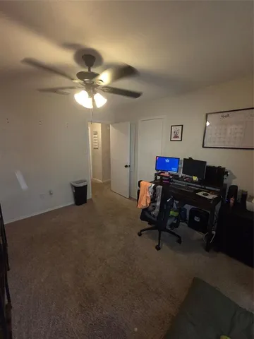 a living room with furniture and a piano