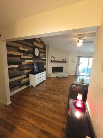 a view of living room with furniture and flat screen tv