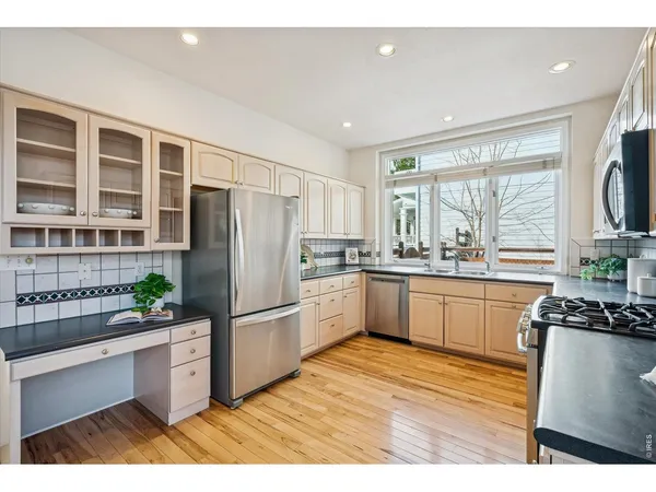 a kitchen with a table and chairs in it