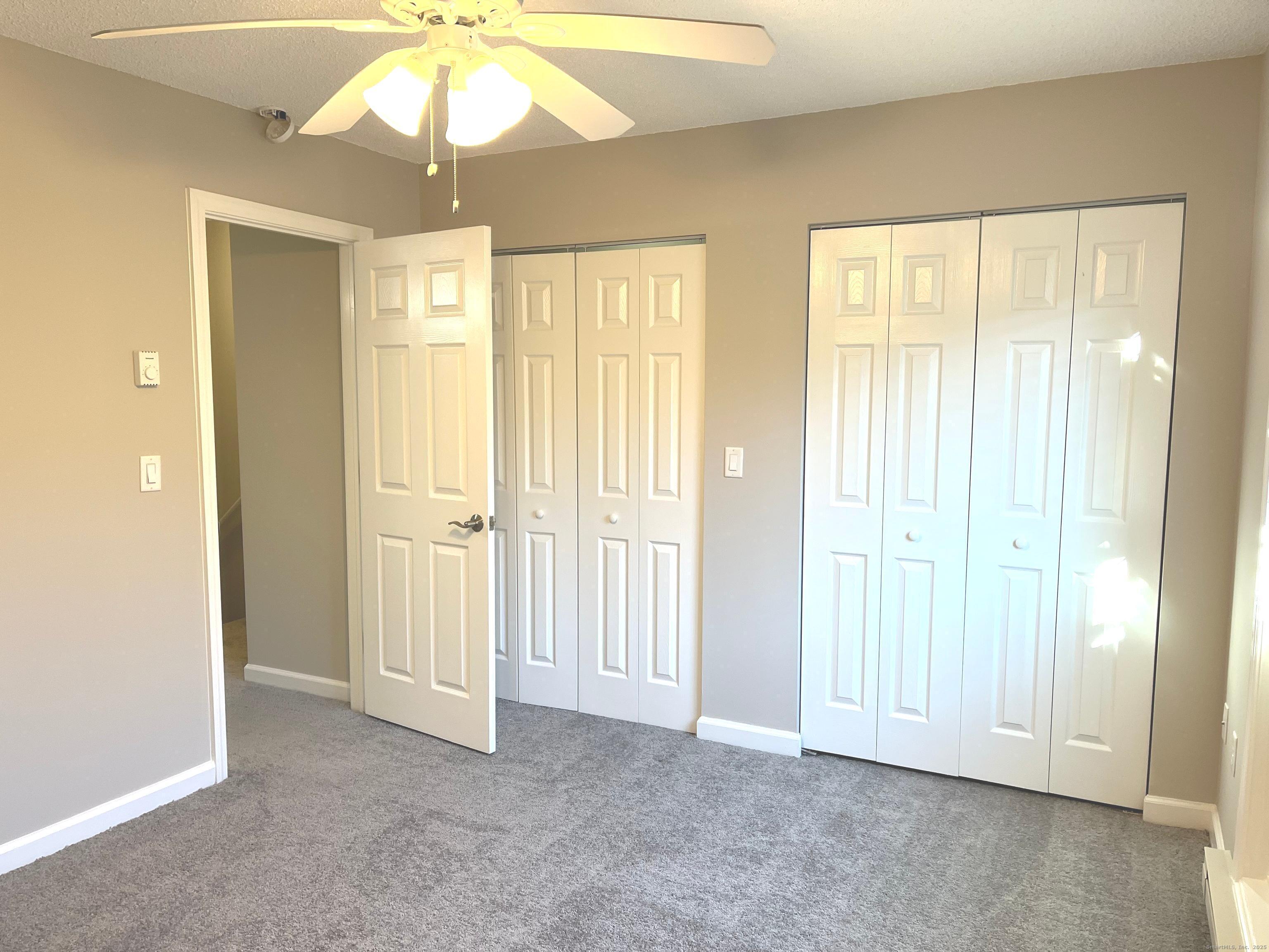 585 Park Road, Unit 112 Waterbury, CT 06708 - Photo 11 of 14 a view of an empty room with a window