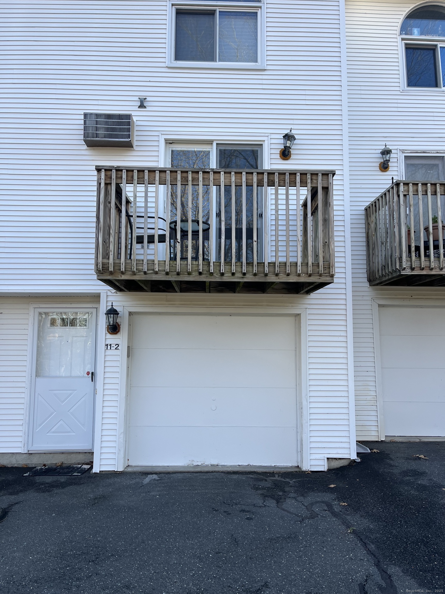 585 Park Road, Unit 112 Waterbury, CT 06708 - Photo 14 of 14 a view of entryway with wooden wall
