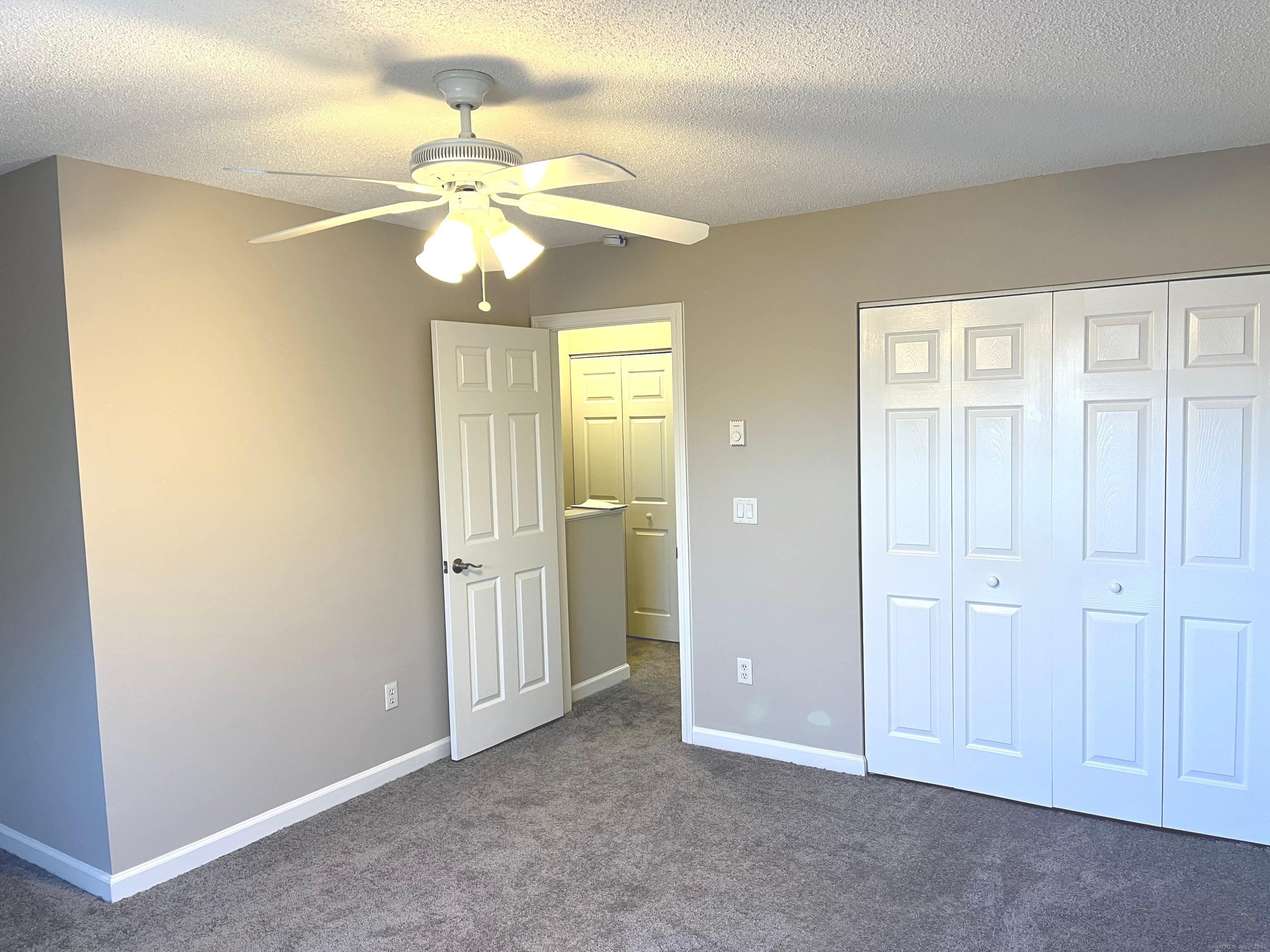 585 Park Road, Unit 112 Waterbury, CT 06708 - Photo 8 of 14 a view of an empty room with a window