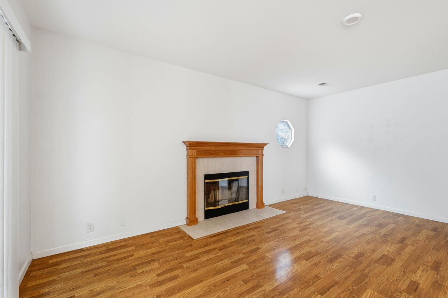 1672 Bailey Drive Ripon, CA 95366 - Photo 14 of 49 a view of an empty room with a fireplace