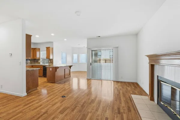 a view of kitchen and dining room with wooden floor