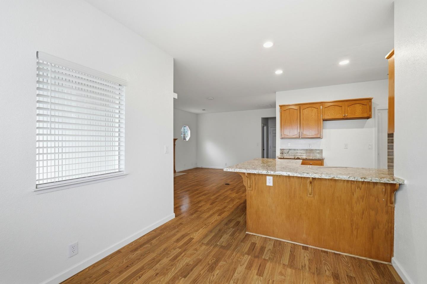 1672 Bailey Drive Ripon, CA 95366 - Photo 20 of 49 a view of a kitchen with wooden floor and a sink