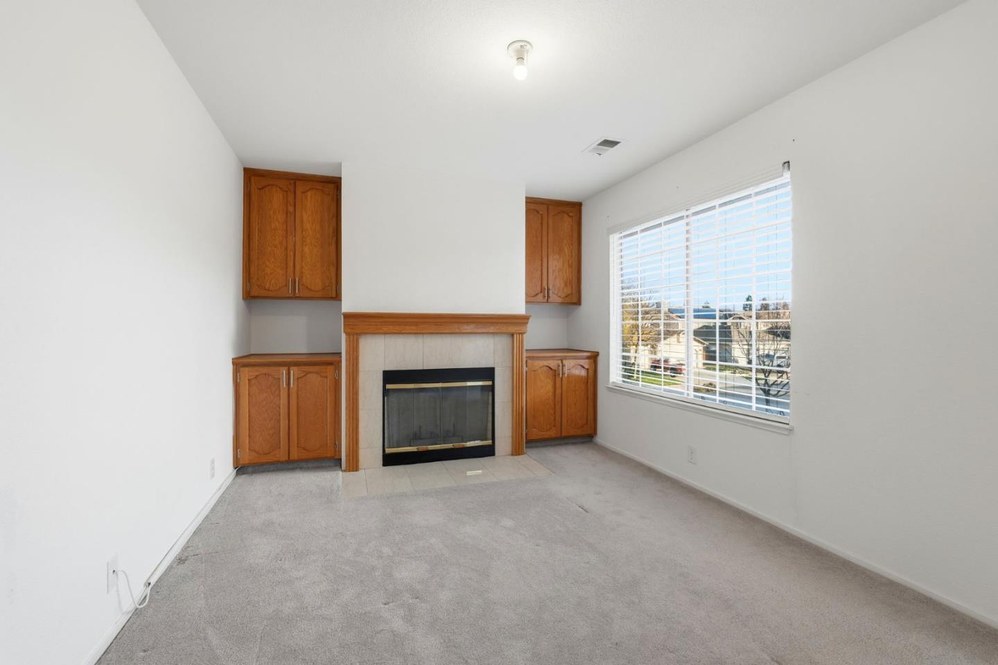 1672 Bailey Drive Ripon, CA 95366 - Photo 22 of 49 a view of livingroom with kitchen and fireplace