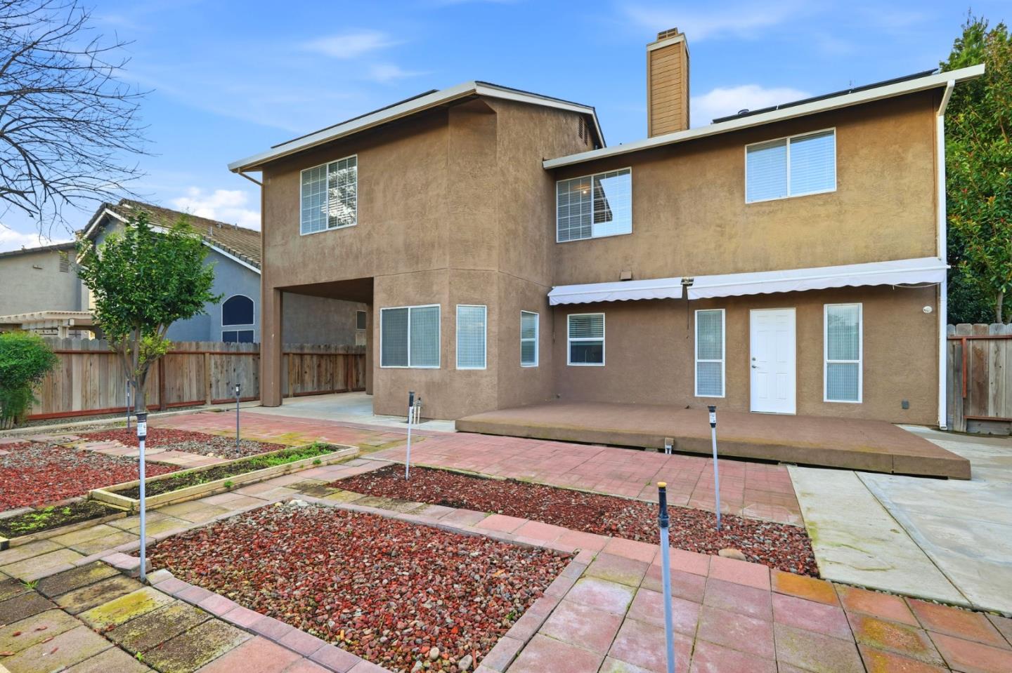 1672 Bailey Drive Ripon, CA 95366 - Photo 47 of 49 a front view of a house with garden