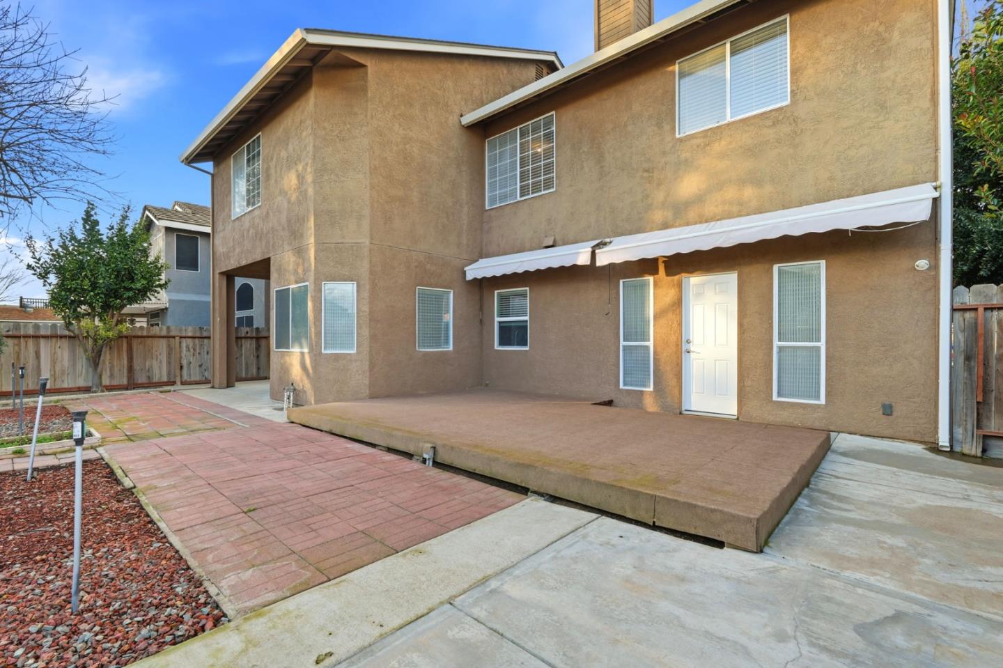 1672 Bailey Drive Ripon, CA 95366 - Photo 49 of 49 a front view of a house with a yard