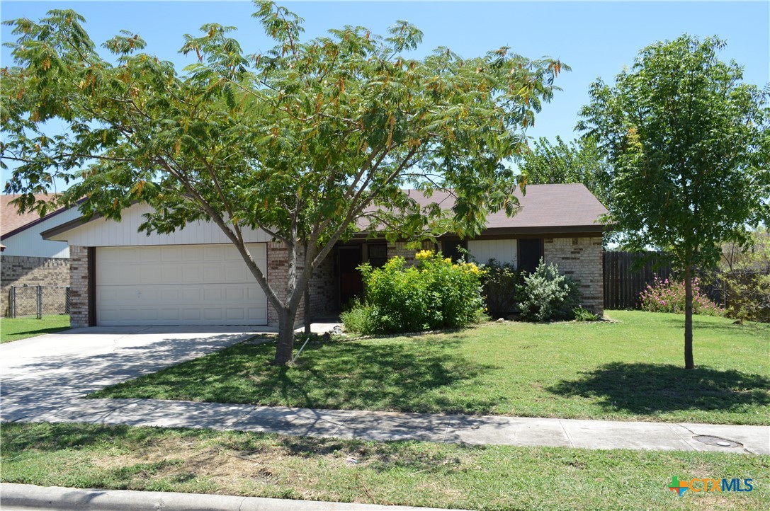 1404 Rob Lane Copperas Cove, TX 76522 - Photo 2 of 31 a front view of a house with a yard and garage