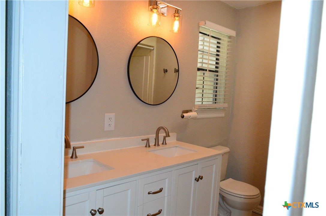 1404 Rob Lane Copperas Cove, TX 76522 - Photo 21 of 31 a bathroom with a sink and a mirror