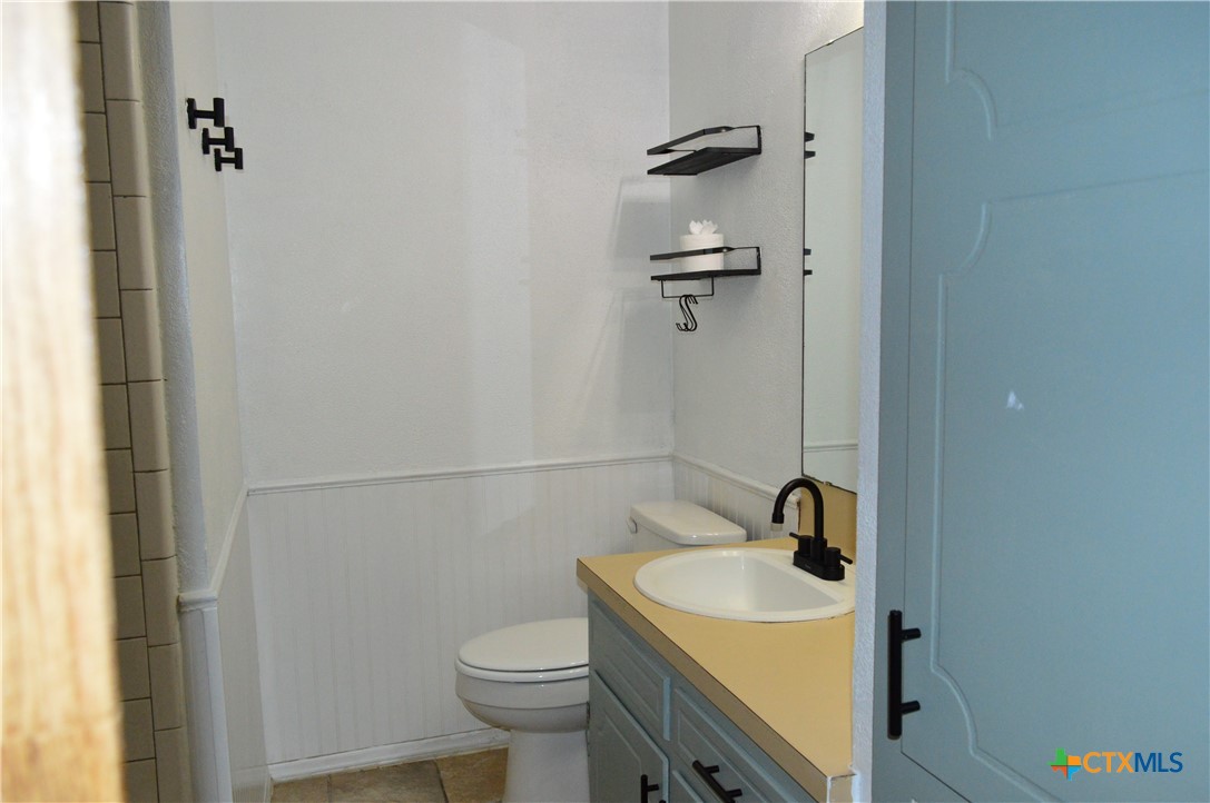 1404 Rob Lane Copperas Cove, TX 76522 - Photo 25 of 31 a bathroom with a sink toilet and shower