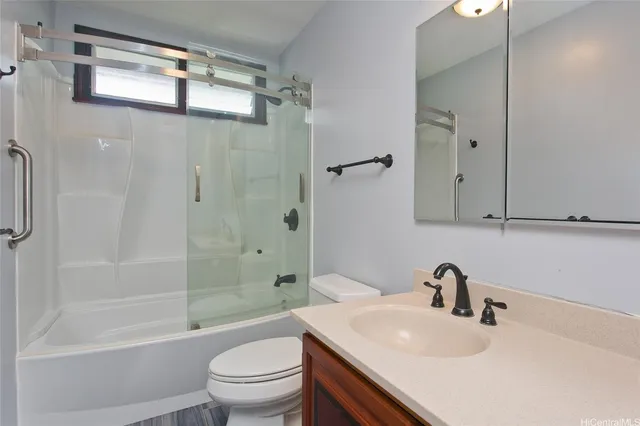 an empty room with fan and windows