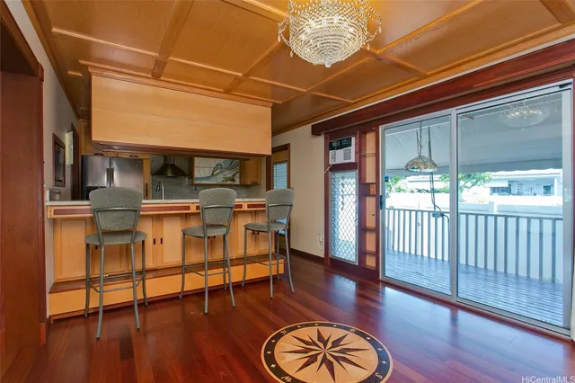 a kitchen with a sink and a refrigerator