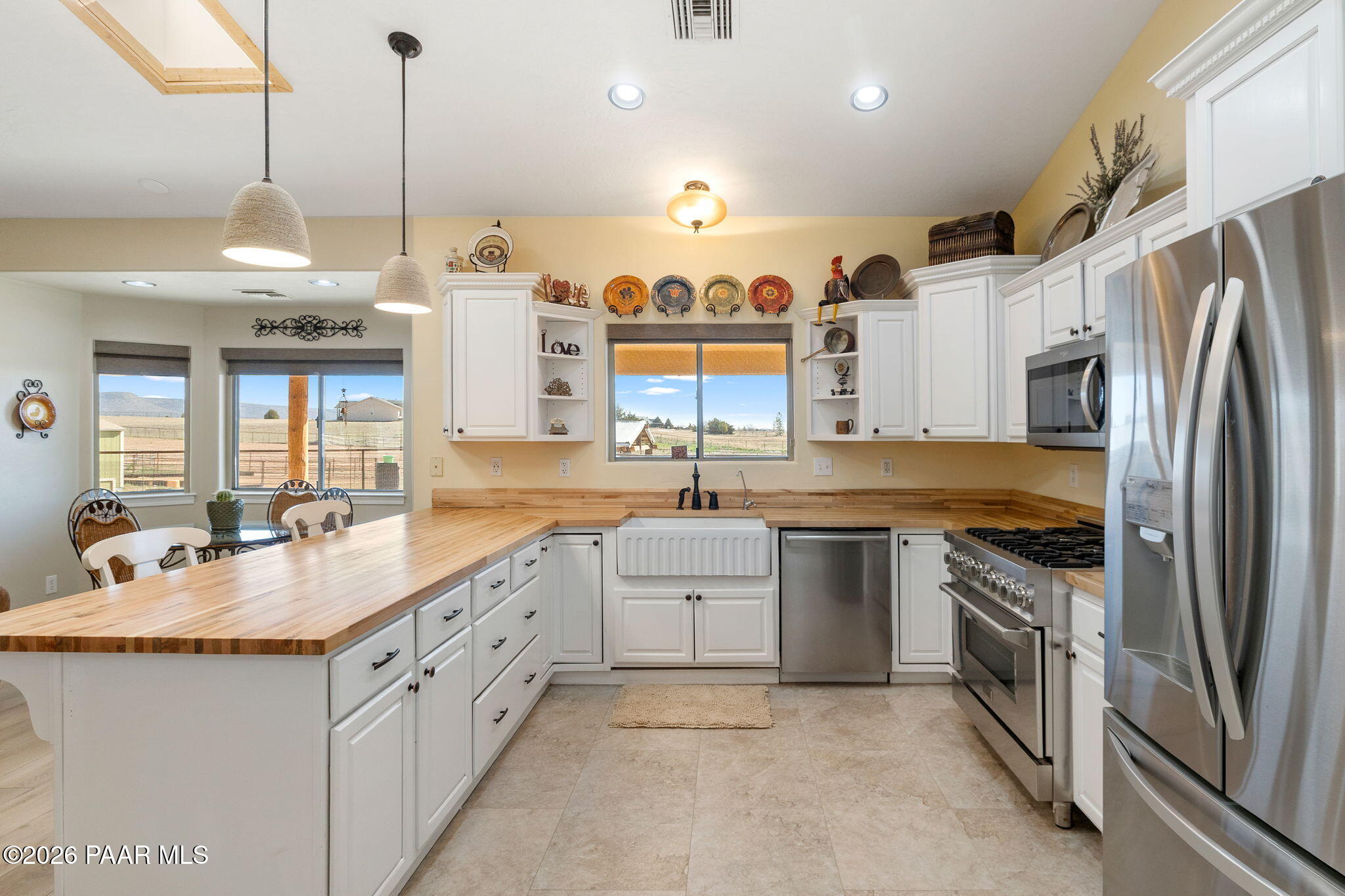 26455 North Bull Snake Road Paulden, AZ 86334 - Photo 11 of 40 a kitchen with stainless steel appliances granite countertop a sink a stove and a refrigerator