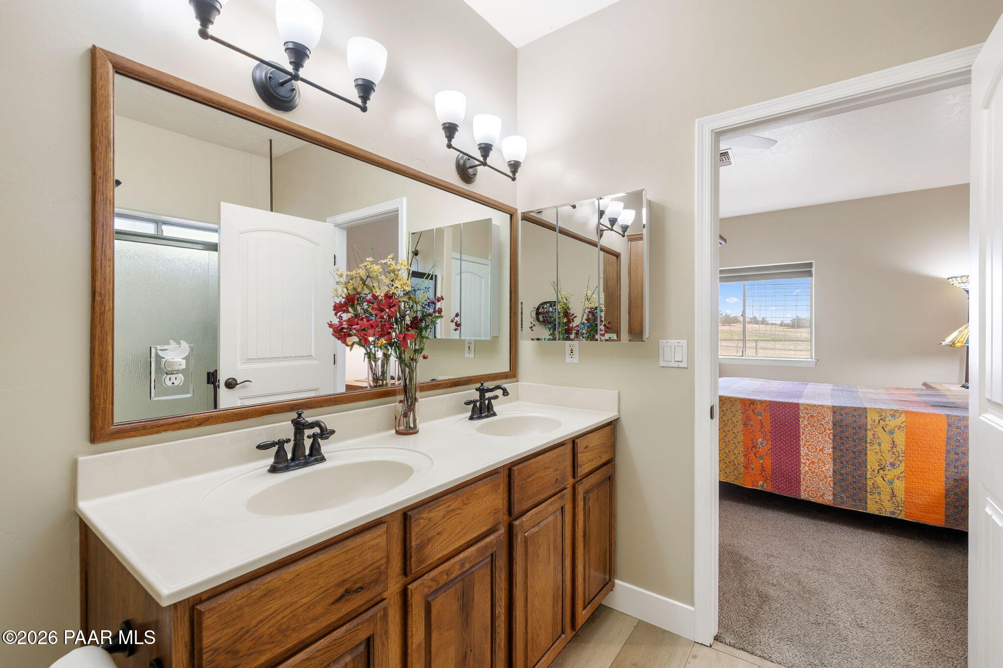 26455 North Bull Snake Road Paulden, AZ 86334 - Photo 16 of 40 a bathroom with a sink double vanity and a mirror
