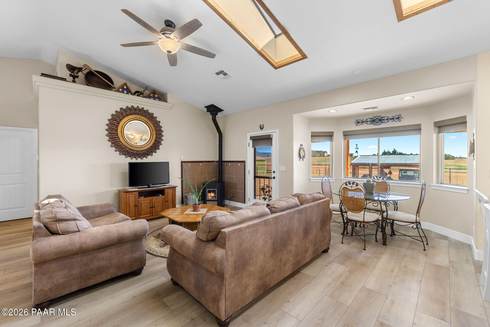 26455 North Bull Snake Road Paulden, AZ 86334 - Photo 6 of 40 a living room with furniture a clock and a window