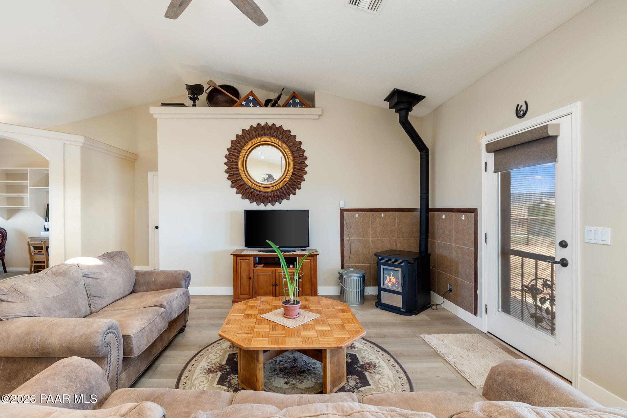 26455 North Bull Snake Road Paulden, AZ 86334 - Photo 8 of 40 a living room with furniture a flat screen tv and a fireplace