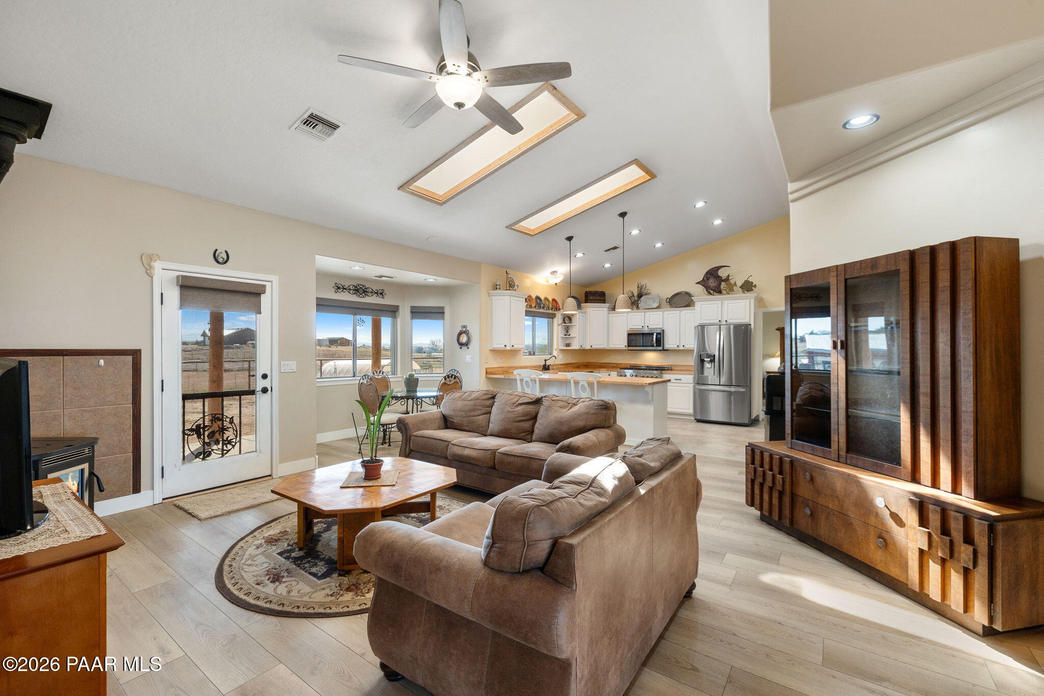 26455 North Bull Snake Road Paulden, AZ 86334 - Photo 9 of 40 a living room with furniture kitchen view and a refrigerator