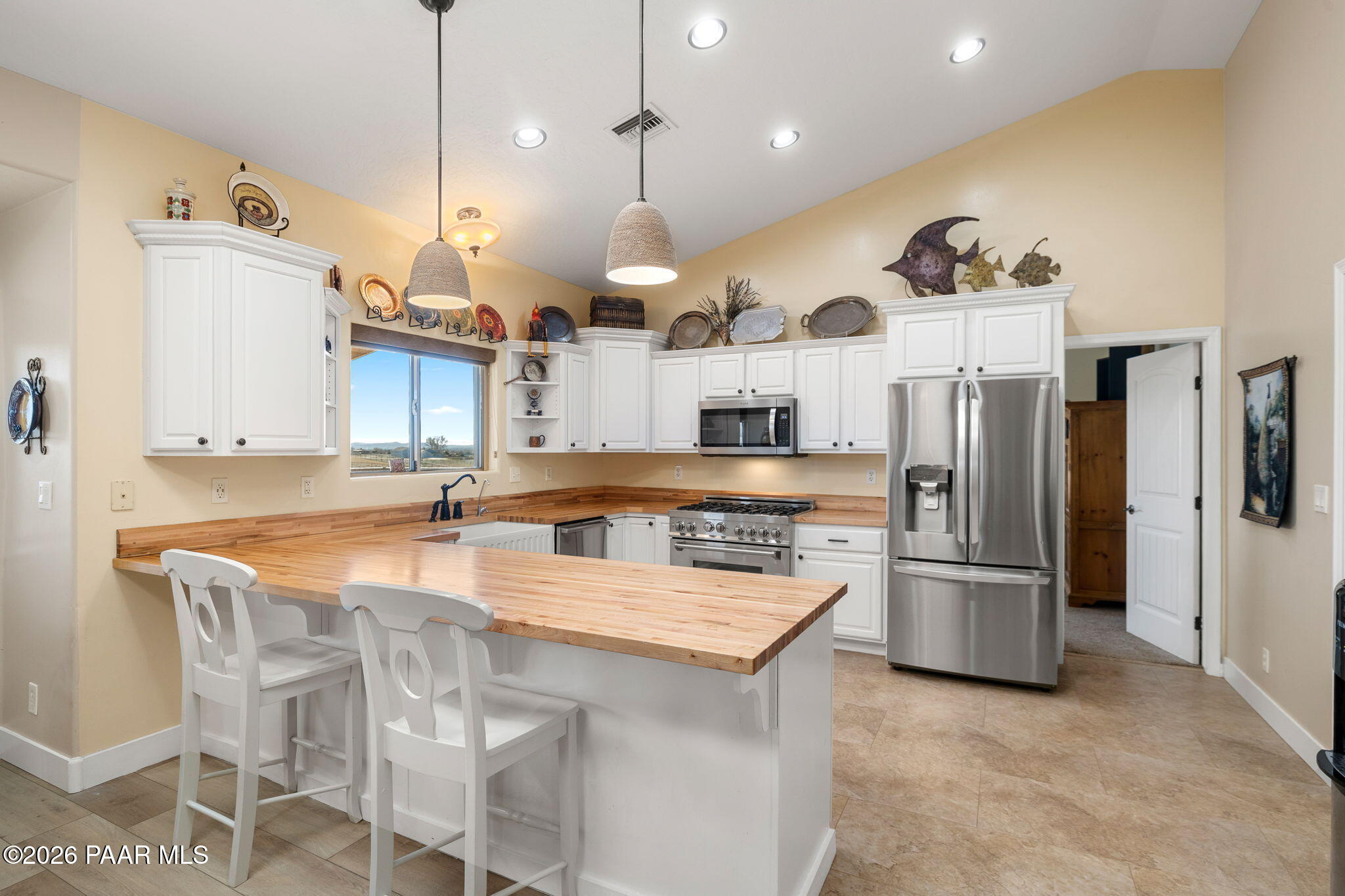 26455 North Bull Snake Road Paulden, AZ 86334 - Photo 10 of 40 a large kitchen with a table and chairs