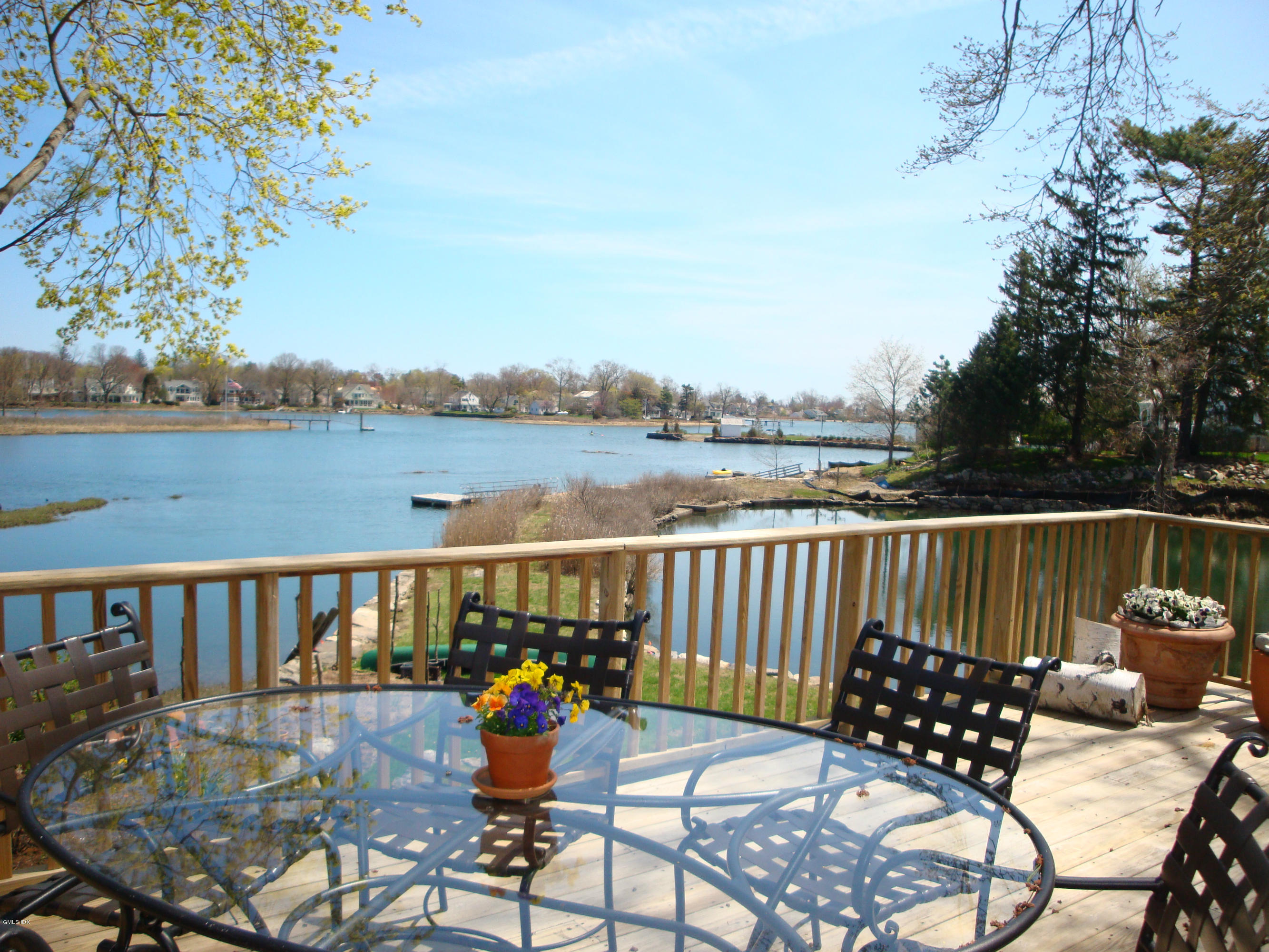 25 Willowmere Avenue Riverside, CT 06878 - Photo 1 of 24 a view of a chairs and table on the deck